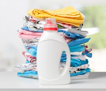 Colorful towels and liquid laundry detergent